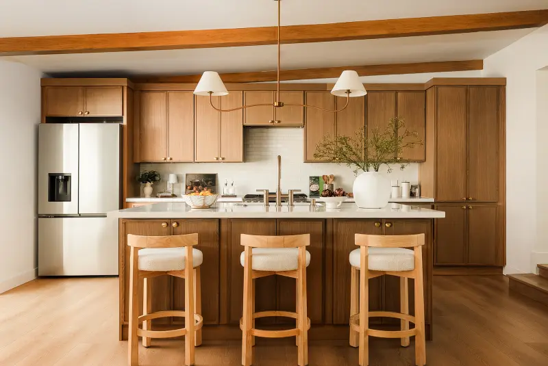 Oak kitchen and a 7-foot island under wood beams